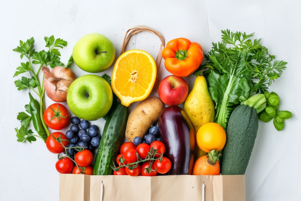 Healthy food background. Healthy food in paper bag vegetables and fruits on white. Food delivery, shopping food supermarket concept